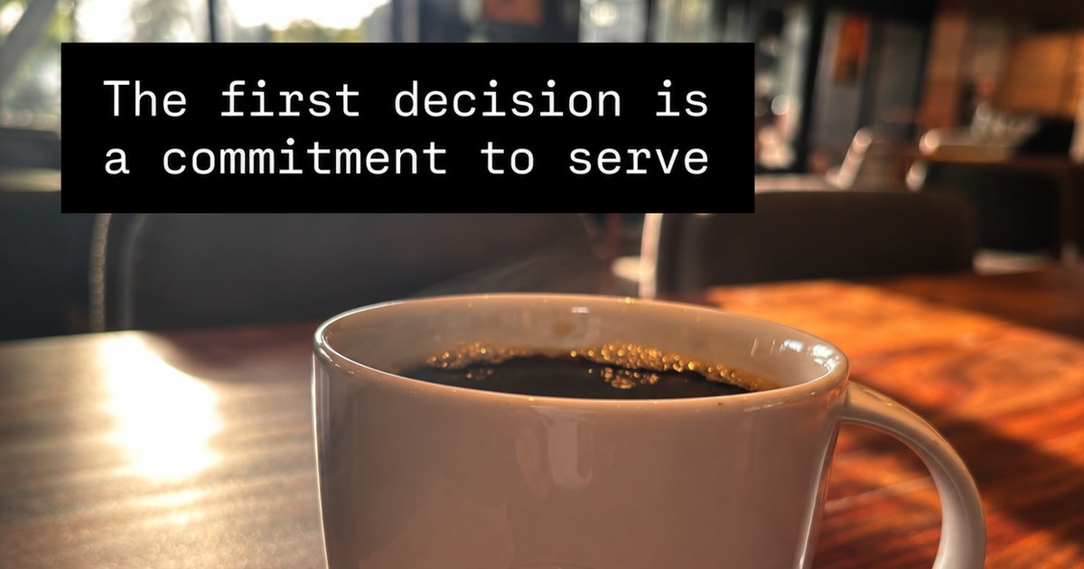 A cup of coffee on a cafe table with the words 'The first decision is a commitment to serve'.